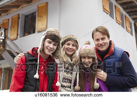 Portrait Of Family Standing Outside Chalet On Ski Holiday View Large Photo Image Stock Photograph - Portrait Of Family Standing Outside Chalet On Ski Holiday. Fotosearch
