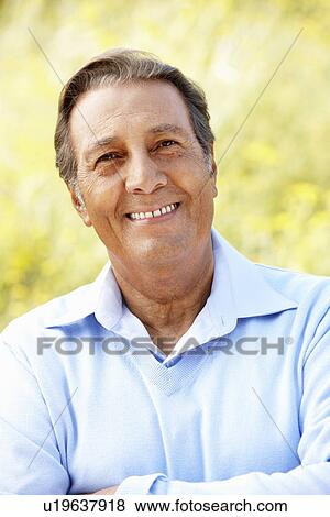 Stock Photo - Portrait senior Hispanic man outdoors. Fotosearch