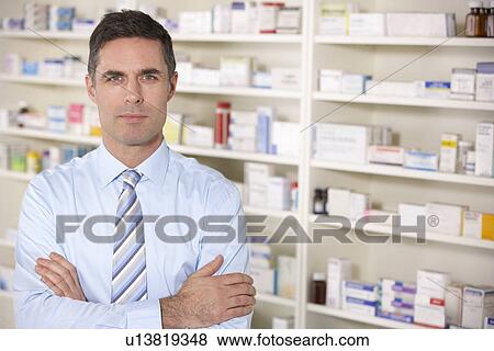 Portrait UK pharmacist at work View Large Photo Image Stock Photo - Portrait UK pharmacist at work. Fotosearch
