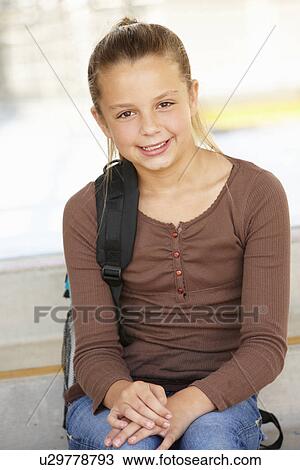 Stock Image - Pre teen girl in school. Fotosearch