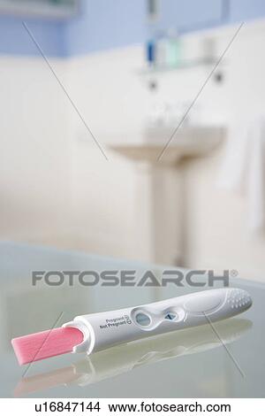 Pregnancy testing kit in bathroom View Large Photo Image Picture - Pregnancy testing kit in bathroom. Fotosearch