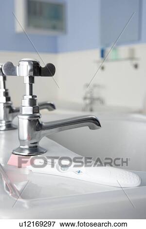 Stock Photo - Pregnancy testing kit in bathroom. Fotosearch