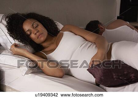 Pregnant woman trying to sleep View Large Photo Image Stock Image - Pregnant woman trying to sleep. Fotosearch