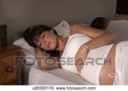 Pregnant woman trying to sleep View Large Photo Image Stock Photograph - Pregnant woman trying to sleep. Fotosearch
