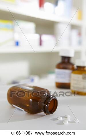 Stock Photo - Prescription pill bottles on pharmacy shelf. Fotosearch