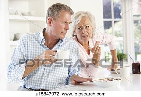 Retired couple arguing at breakfast View Large Photo Image Stock Image - Retired couple arguing at breakfast. Fotosearch
