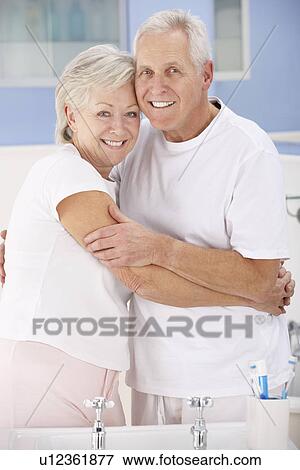 Senior couple hugging in bathroom View Large Photo Image Stock Photo - Senior couple hugging in bathroom. Fotosearch