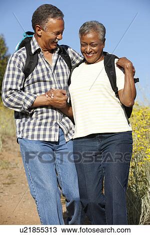 Stock Image - Senior couple on country hike. Fotosearch