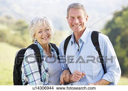 Picture - Senior couple on country walk. Fotosearch
