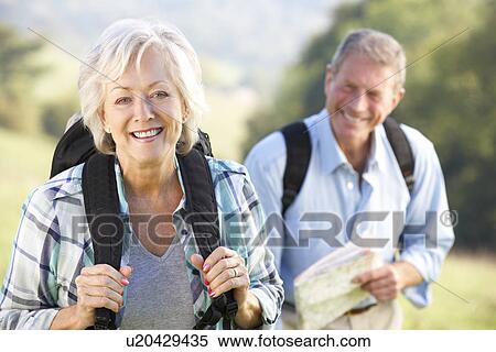 Senior couple on country walk View Large Photo Image Stock Photography - Senior couple on country walk. Fotosearch