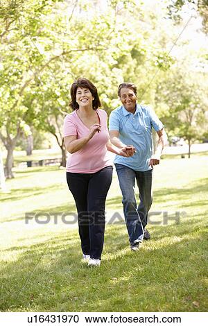 Stock Image - Senior Hispanic couple outdoors. Fotosearch