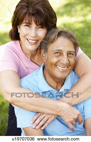 Stock Photograph - Senior Hispanic couple outdoors. Fotosearch