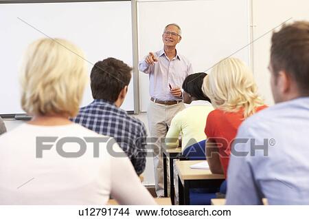 Picture - Senior tutor teaching class. Fotosearch
