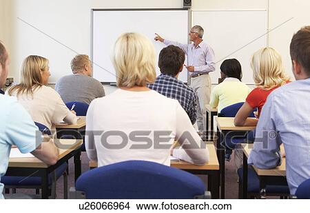 Senior tutor teaching class View Large Photo Image Picture - Senior tutor teaching class. Fotosearch