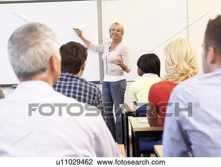 Senior tutor teaching class View Large Photo Image Stock Image - Senior tutor teaching class. Fotosearch