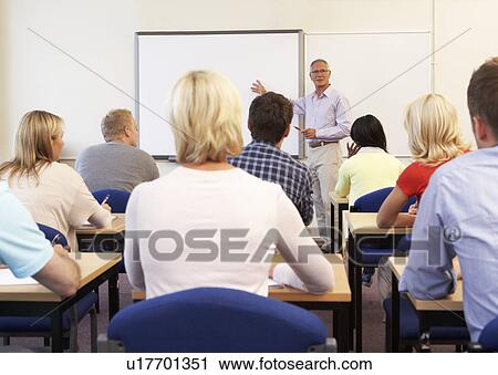Senior tutor teaching class View Large Photo Image Stock Image - Senior tutor teaching class. Fotosearch