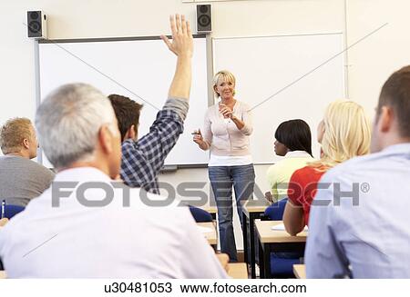Senior tutor teaching class View Large Photo Image Stock Image - Senior tutor teaching class. Fotosearch