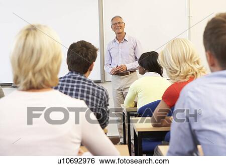 Senior tutor teaching class View Large Photo Image Stock Photograph - Senior tutor teaching class. Fotosearch