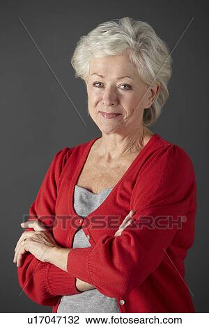 Stock Image - Senior woman studio portrait. Fotosearch