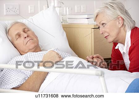 Senior woman visiting husband in hospital View Large Photo Image Stock Photo - Senior woman visiting husband in hospital. Fotosearch