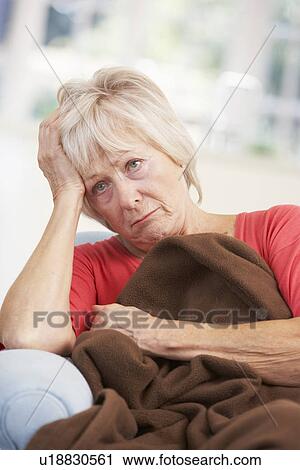 Sick, unhappy older woman at home View Large Photo Image Stock Image - Sick, unhappy older woman at home. Fotosearch