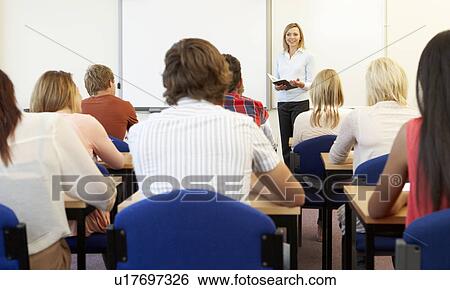 Stock Photograph - Students and tutor in class. Fotosearch