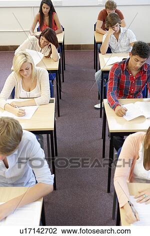 Stock Image - Students sitting exam. Fotosearch