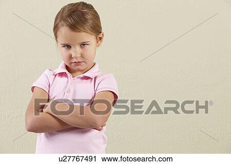 Stock Image - Studio Shot Of Angry Young Girl. Fotosearch