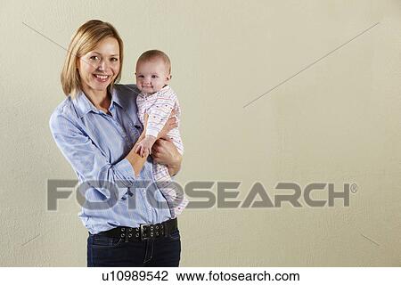 Studio Shot Of Happy Mother and Baby View Large Photo Image Stock Image - Studio Shot Of Happy Mother and Baby. Fotosearch
