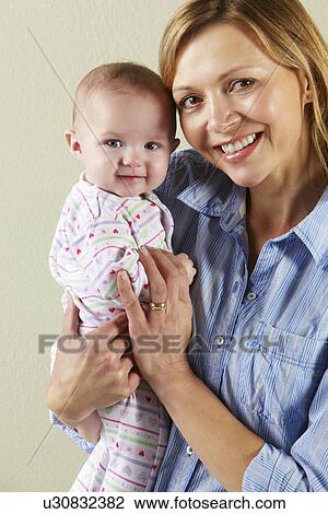 Studio Shot Of Happy Mother and Baby View Large Photo Image Stock Image - Studio Shot Of Happy Mother and Baby. Fotosearch