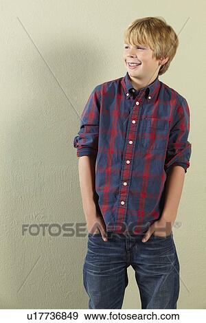 Stock Photo - Studio Shot Of Happy Young Boy. Fotosearch