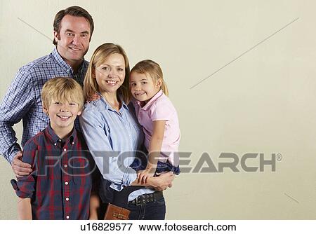 Studio Shot Of Relaxed Family View Large Photo Image Stock Photo - Studio Shot Of Relaxed Family. Fotosearch