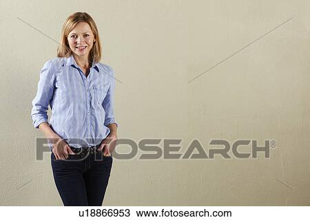 Stock Image - Studio Shot Of Relaxed Middle Aged Woman. Fotosearch