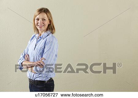 Stock Photo - Studio Shot Of Relaxed Middle Aged Woman. Fotosearch