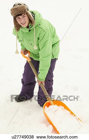 Teenage Boy Shovelling Snow From Path View Large Photo Image Stock Photo - Teenage Boy Shovelling Snow From Path. Fotosearch