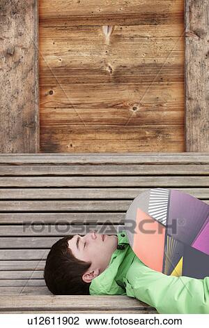 Teenage Boy With Snowboard On Ski Holiday Lying On Wooden Bench View Large Photo Image Stock Image - Teenage Boy With Snowboard On Ski Holiday Lying On Wooden Bench. Fotosearch