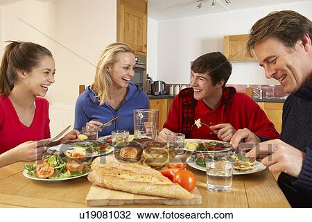 Teenage Family Eating Lunch Together In Kitchen View Large Photo Image Stock Image - Teenage Family Eating Lunch Together In Kitchen. Fotosearch