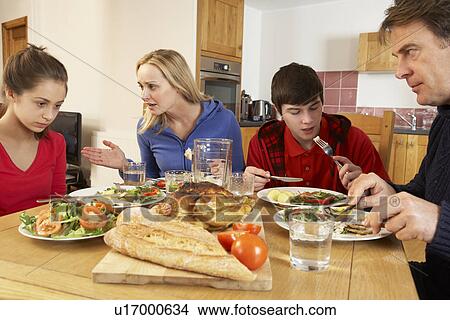 Teenage Family Having Argument Whilst Eating Lunch Together In Kitchen View Large Photo Image Picture - Teenage Family Having Argument Whilst Eating Lunch Together In Kitchen. Fotosearch