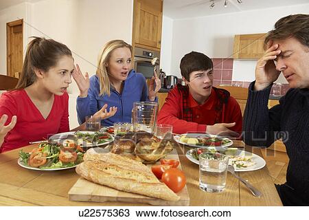 Teenage Family Having Argument Whilst Eating Lunch Together In Kitchen View Large Photo Image Stock Image - Teenage Family Having Argument Whilst Eating Lunch Together In Kitchen. Fotosearch