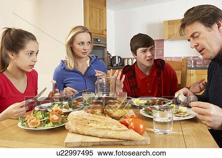 Teenage Family Having Argument Whilst Eating Lunch Together In Kitchen View Large Photo Image Stock Photography - Teenage Family Having Argument Whilst Eating Lunch Together In Kitchen. Fotosearch