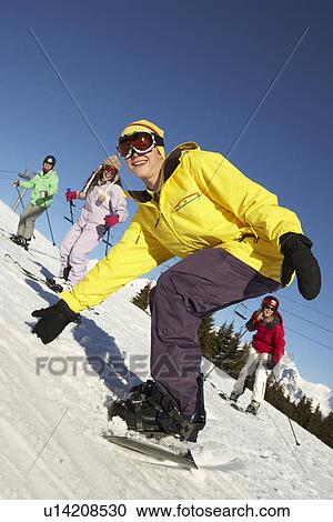 Teenage Family On Ski Holiday In Mountains View Large Photo Image Stock Image - Teenage Family On Ski Holiday In Mountains. Fotosearch