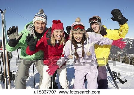 Stock Photo - Teenage Family On Ski Holiday In Mountains. Fotosearch