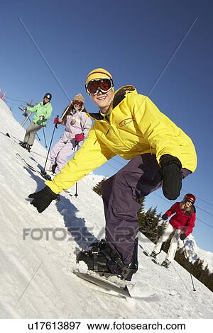 Teenage Family On Ski Holiday In Mountains View Large Photo Image Stock Photo - Teenage Family On Ski Holiday In Mountains. Fotosearch