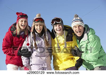 Teenage Family On Ski Holiday In Mountains View Large Photo Image Stock Photo - Teenage Family On Ski Holiday In Mountains. Fotosearch