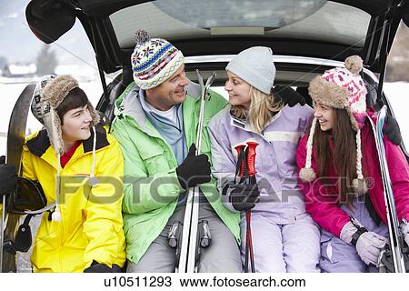 Teenage Family Sitting In Boot Of Car With Skis View Large Photo Image Stock Image - Teenage Family Sitting In Boot Of Car With Skis. Fotosearch