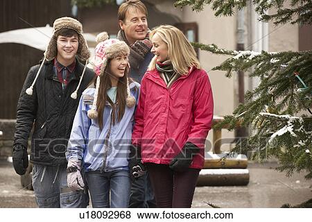 Teenage Family Walking Along Snowy Town Street In Ski Resort View Large Photo Image Stock Photo - Teenage Family Walking Along Snowy Town Street In Ski Resort. Fotosearch