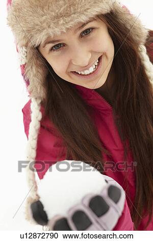 Teenage Girl Holding Snowball Wearing Fur Hat View Large Photo Image Stock Image - Teenage Girl Holding Snowball Wearing Fur Hat. Fotosearch