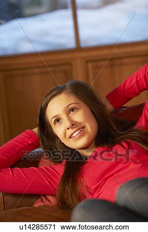Teenage Girl Relaxing On Sofa View Large Photo Image Stock Image - Teenage Girl Relaxing On Sofa. Fotosearch