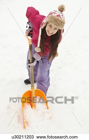 Teenage Girl Shovelling Snow From Path View Large Photo Image Stock Image - Teenage Girl Shovelling Snow From Path. Fotosearch