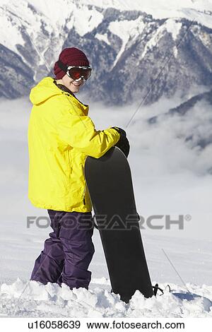 Teenage Snowboarder Admiring Mountain View Whilst On Ski Holiday In Mountains View Large Photo Image Stock Photo - Teenage Snowboarder Admiring Mountain View Whilst On Ski Holiday In Mountains. Fotosearch